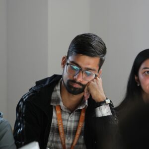 University students attentively taking part in a seminar discussion.