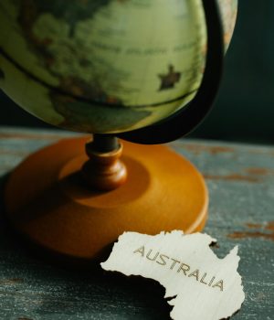 Creative representation of Australia with a globe in the background.
